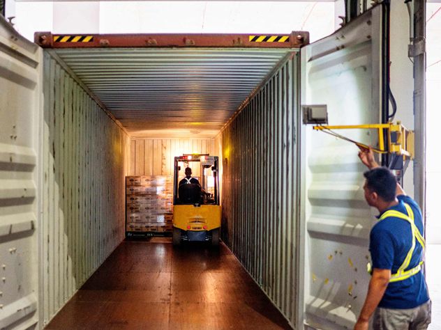 View inside a shipping container while being loaded